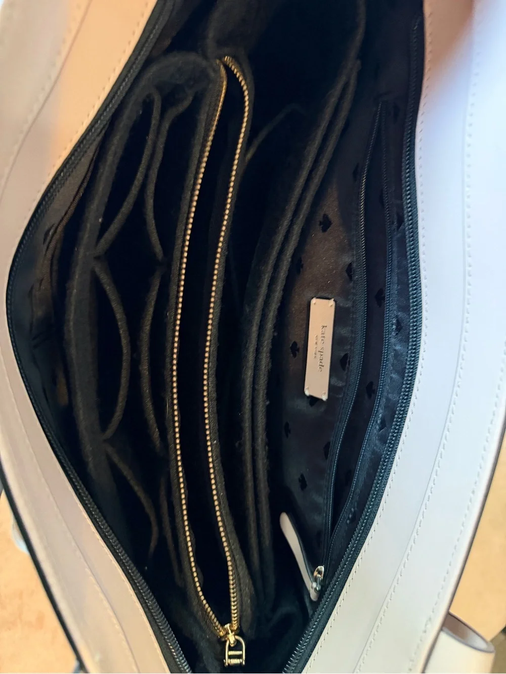 kate spade black tote with cream straps and floral charm